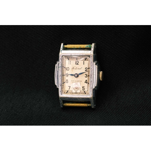 199 - Four Art Deco gentleman's manual wind nickel tank cased wristwatches. Including an Ingersol Elite wi... 