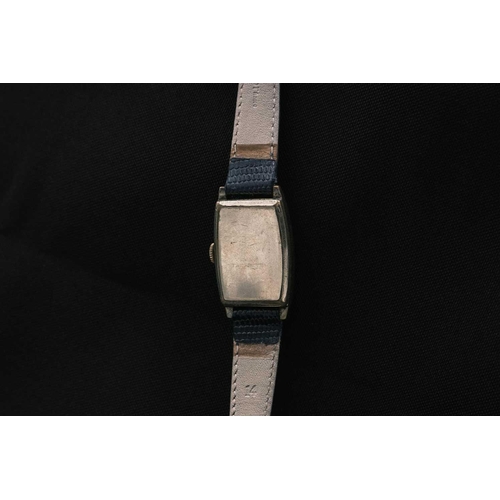 221 - Three Art Deco gentleman's manual wind tank wristwatches. One by Winegartens, in a nickel case, the ... 