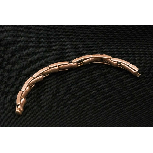 247 - A Premo 9ct rose gold expanding watch bracelet. Weight 4.5g.