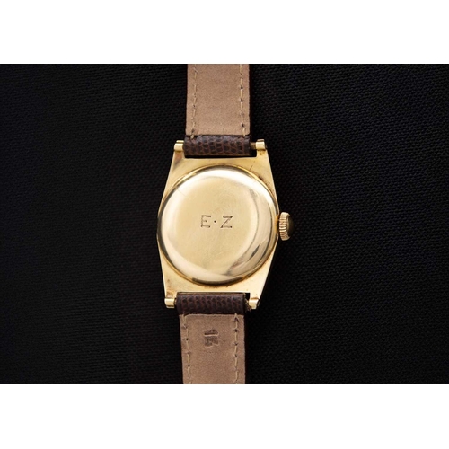 44 - MOVADO FOR TIFFANY & CO. - A 14ct cased mid-sized gentleman's manual wind wristwatch. The 22mm gilt ... 