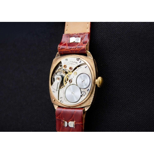 66 - WALTHAM - A 9ct cased 1930's cushion cased gentleman's manual wind wristwatch. The 25mm white enamel... 