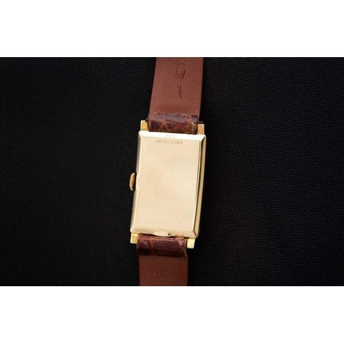 81 - HAMILTON - A 14ct tank-cased gentleman's manual wind wristwatch. The signed 16mm cream dial with gil... 