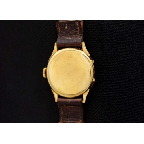 84 - An 18ct gold-cased 1920's manual wind gentleman's wristwatch. The 29mm dial with a silvered chapter ... 