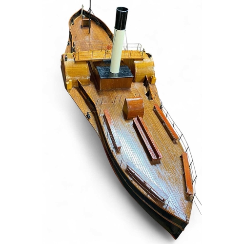 33 - A Scratch built model paddle steamer 'Waterlilly'. Mid 20th century, with a painted tin hull and pla... 