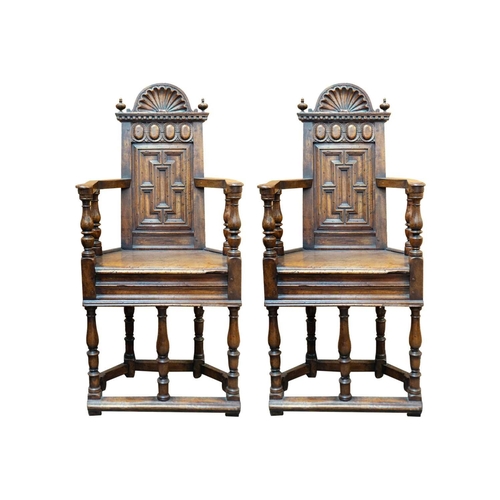 1003 - A matched pair of French Renaissance walnut caquetoire chairs. Circa 1570, the backs with arched cre... 