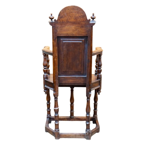 1003 - A matched pair of French Renaissance walnut caquetoire chairs. Circa 1570, the backs with arched cre... 