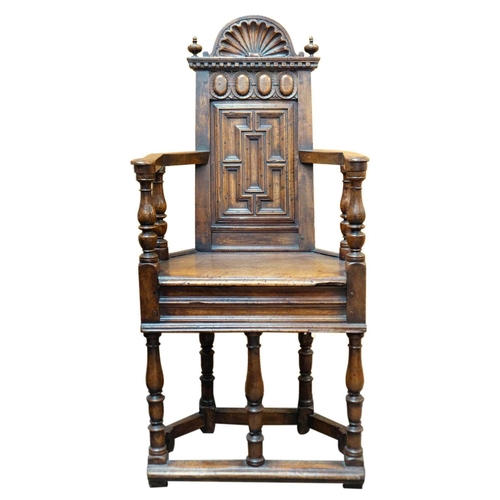 1003 - A matched pair of French Renaissance walnut caquetoire chairs. Circa 1570, the backs with arched cre... 