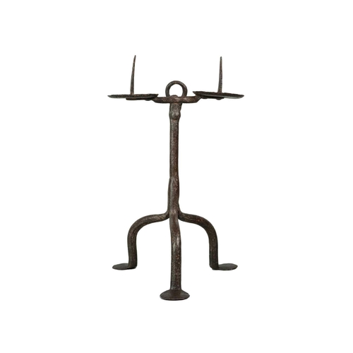 1007 - An English wrought iron double pricket candlestick. 17th century, with a suspension hook, for wall h... 