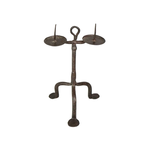 1007 - An English wrought iron double pricket candlestick. 17th century, with a suspension hook, for wall h... 