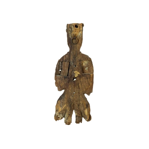 1031 - An English carved oak figure of a crowned angel. 15th century, with upheld hands, traces of gilt and... 