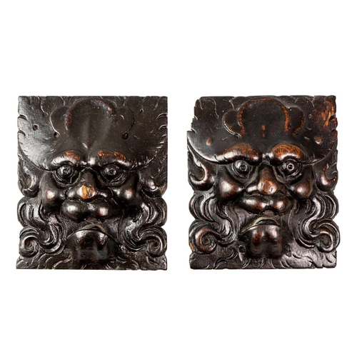 1032 - A pair of carved oak Green Man masks. English or Flemish, 15th/16th century, each 15.5X13.5cm (2). F... 