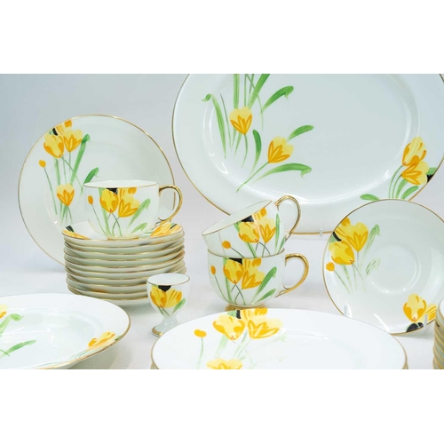 1039 - A Paragon china part breakfast service. Hand painted with a crocus design and comprising 12 plates, ... 