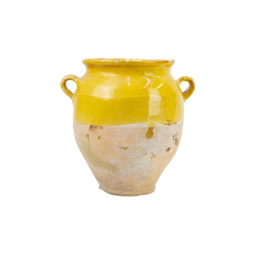 1040 - Two French provincial yellow glazed pots. 19th century, each with simple loop handles, height 16.5 a... 