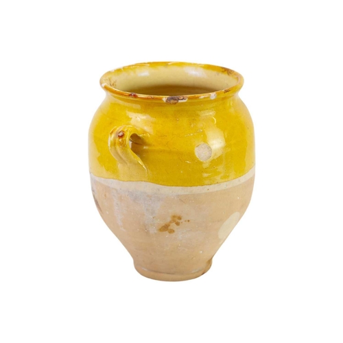 1040 - Two French provincial yellow glazed pots. 19th century, each with simple loop handles, height 16.5 a... 