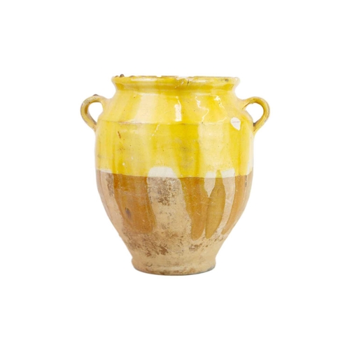 1040 - Two French provincial yellow glazed pots. 19th century, each with simple loop handles, height 16.5 a... 