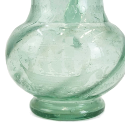 1045 - A Continental blown glass water jug. Etched with a sailing ship, height 25cm, together with a glass ... 