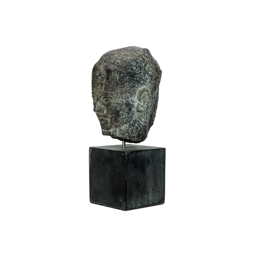 1051 - An Egyptian granite head of a pharaoh. Raised on a heavy base, the head height 15cm. Mollie & Graham... 