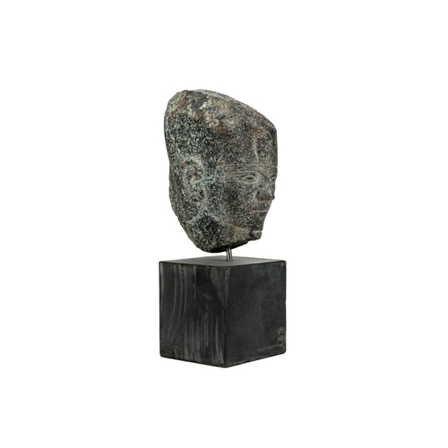 1051 - An Egyptian granite head of a pharaoh. Raised on a heavy base, the head height 15cm. Mollie & Graham... 