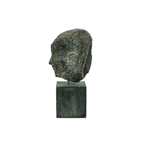 1051 - An Egyptian granite head of a pharaoh. Raised on a heavy base, the head height 15cm. Mollie & Graham... 