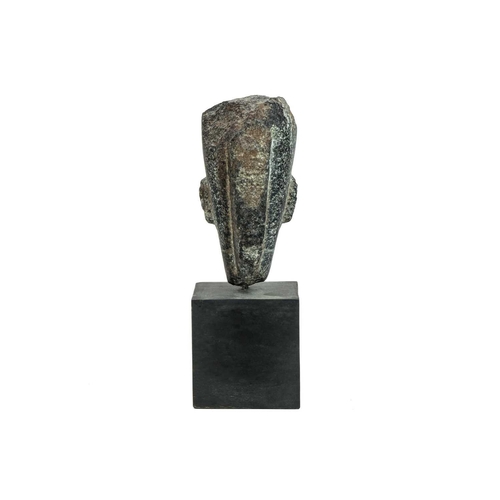 1051 - An Egyptian granite head of a pharaoh. Raised on a heavy base, the head height 15cm. Mollie & Graham... 