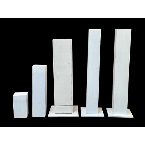 1054 - A pair of white painted display plinths. Height 117cm, and three others various (5)