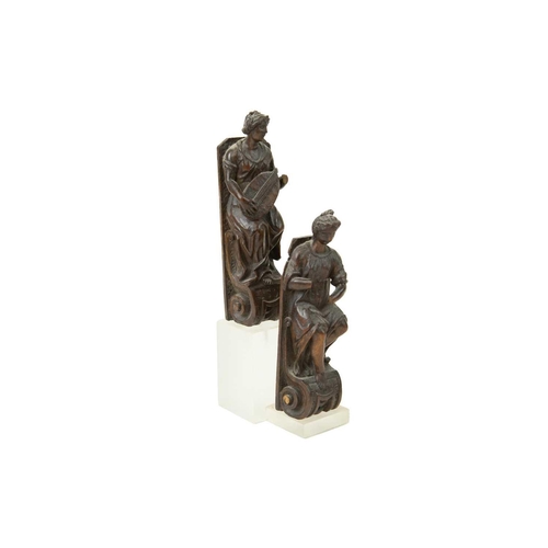 1057 - A pair of Italian walnut figures of musicians. 17th or early 18th century, one playing a lute, on vo... 