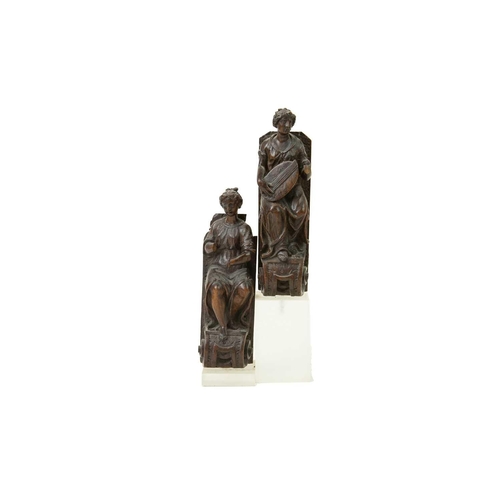 1057 - A pair of Italian walnut figures of musicians. 17th or early 18th century, one playing a lute, on vo... 