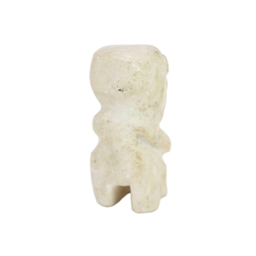 1067 - A carved white stone figure. Possibly South Seas, height 12cm. Mollie & Graham met in Wimbledon in 1... 