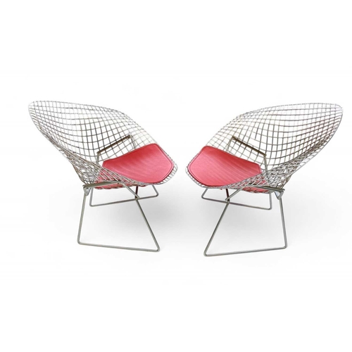 1092 - After Harry Bertoia a pair of 'Diamond' armchairs. Modern, of wire mesh construction, with red padde... 