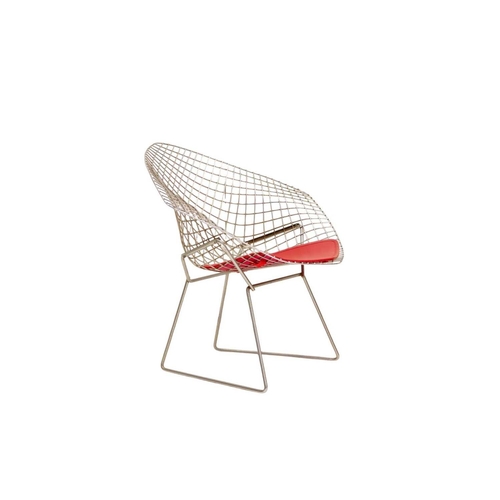 1092 - After Harry Bertoia a pair of 'Diamond' armchairs. Modern, of wire mesh construction, with red padde... 