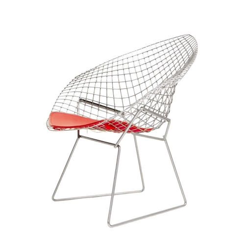 1092 - After Harry Bertoia a pair of 'Diamond' armchairs. Modern, of wire mesh construction, with red padde... 