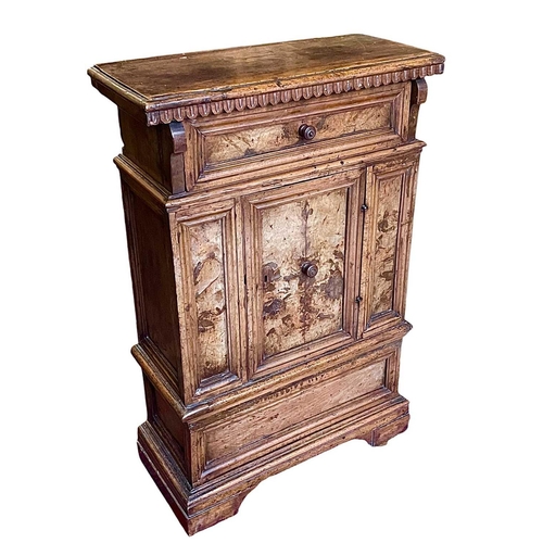 1095 - A North Italian Baroque walnut credenza. 17th century, of diminutive proportions, panelled construct... 