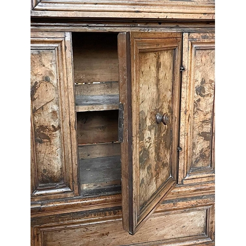 1095 - A North Italian Baroque walnut credenza. 17th century, of diminutive proportions, panelled construct... 