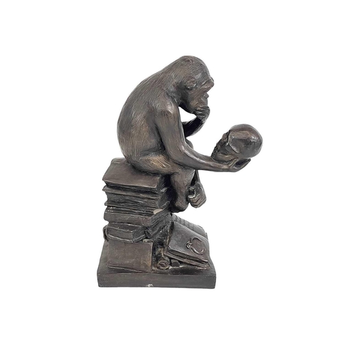 11 - A resin model of Darwin's ape. Height 33cm.