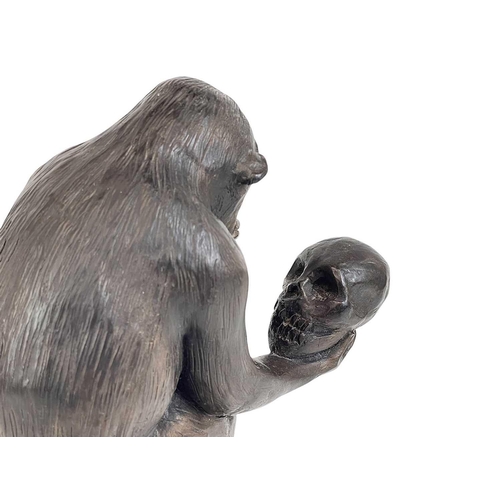 11 - A resin model of Darwin's ape. Height 33cm.