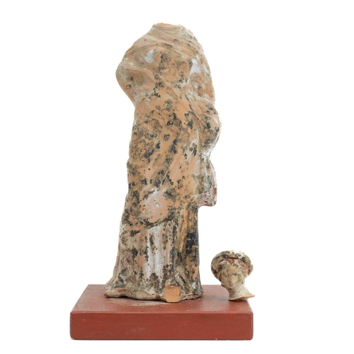 1101 - A Greek Tanagra figure. 400-300 BC, modelled as a classical female, traces of white pigment, height ... 