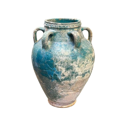 1107 - A Parthian turquoise glazed pottery amphora. 2nd-3rd century AD, with six loop handles, height 37cm,... 