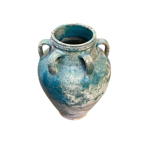 1107 - A Parthian turquoise glazed pottery amphora. 2nd-3rd century AD, with six loop handles, height 37cm,... 