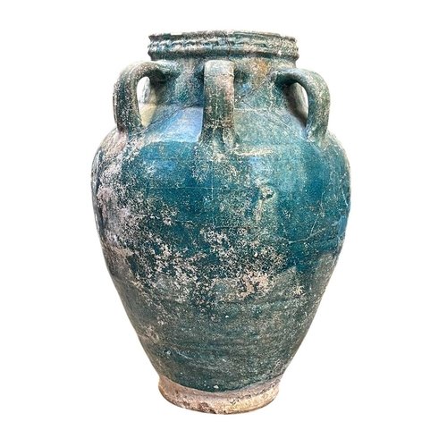 1107 - A Parthian turquoise glazed pottery amphora. 2nd-3rd century AD, with six loop handles, height 37cm,... 