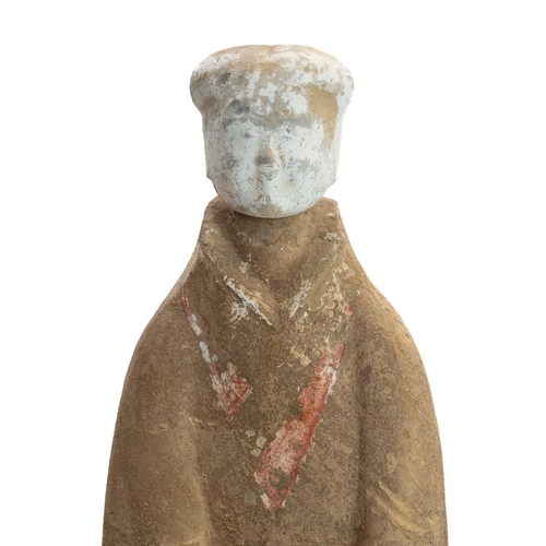 1113 - A Large Chinese funerary figure or tomb attendant. Han dynasty, with a separate head and traces of r... 