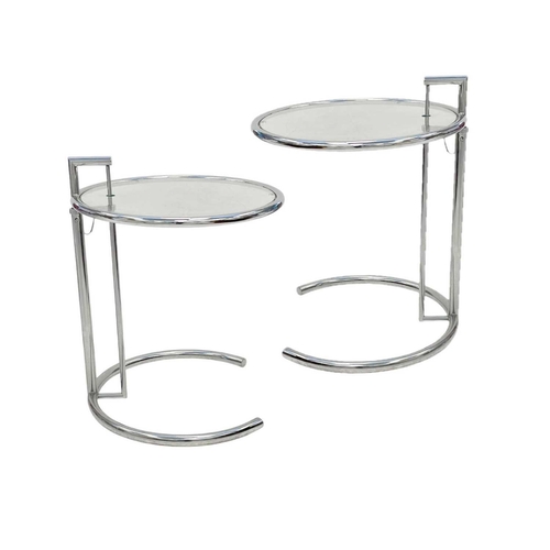 1116 - Eileen Gray, A pair of chrome and glass E1027 tables. Modern, with rise and fall glass tops, on hors... 