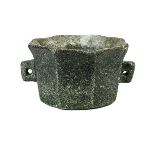 1127 - A German octagonal serpentine mortar. 16th/17th century, with simple twin handles and pouring spout,... 