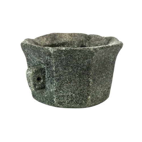 1127 - A German octagonal serpentine mortar. 16th/17th century, with simple twin handles and pouring spout,... 