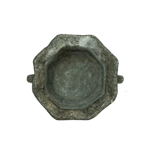 1127 - A German octagonal serpentine mortar. 16th/17th century, with simple twin handles and pouring spout,... 