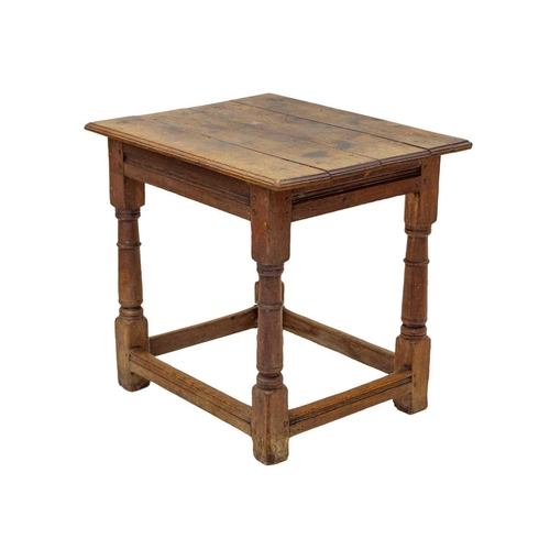 1149 - An English oak centre or altar table. 17th century, the four plank top raised on stout turned legs, ... 