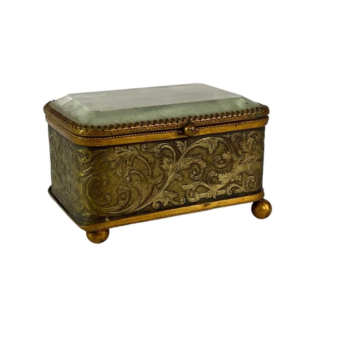 115 - A collection of curiosities, contained in a French glass topped brass casket. Including a Tunbridgew... 