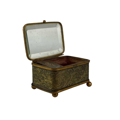 115 - A collection of curiosities, contained in a French glass topped brass casket. Including a Tunbridgew... 