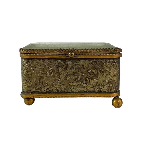 115 - A collection of curiosities, contained in a French glass topped brass casket. Including a Tunbridgew... 