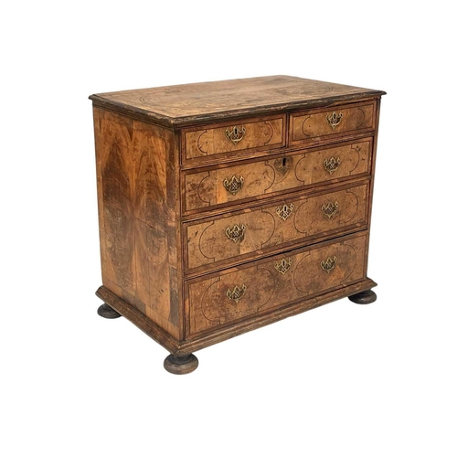 1158 - A Queen Anne figured walnut, chevron banded and ebony strung chest. Of two short and three long, on ... 