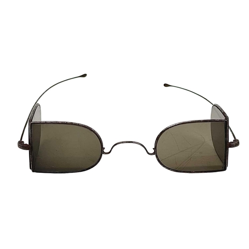 116 - A pair of Victorian Double D Railway sunglasses. With smoke tinted lens.